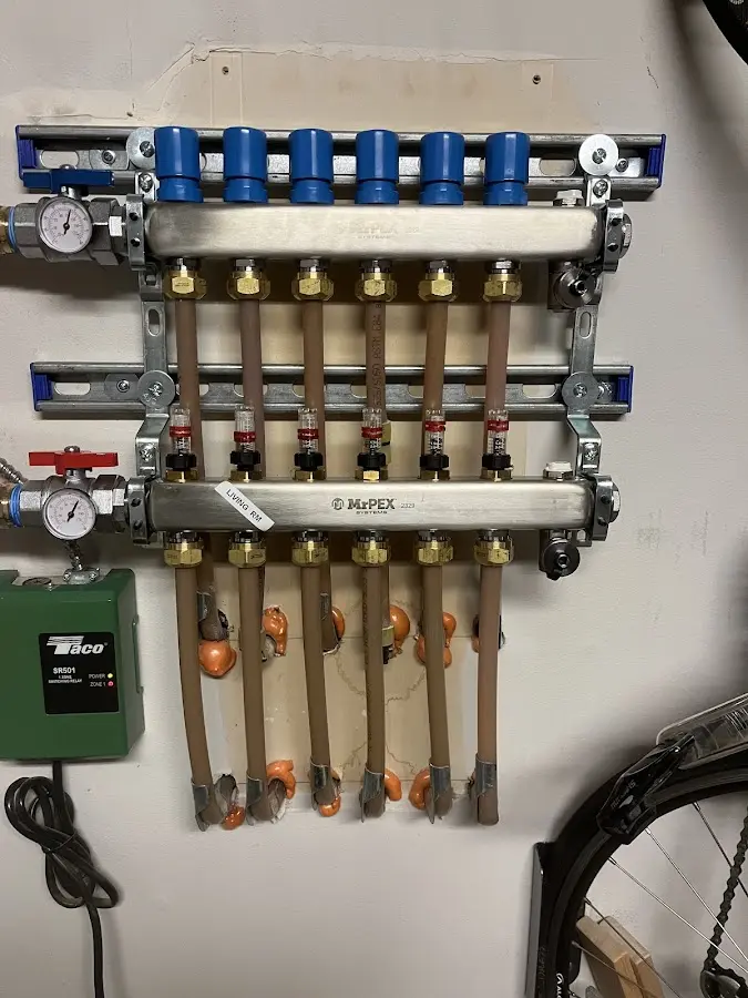 Plumber performing Water Heater Repair at a residential property in Richmond